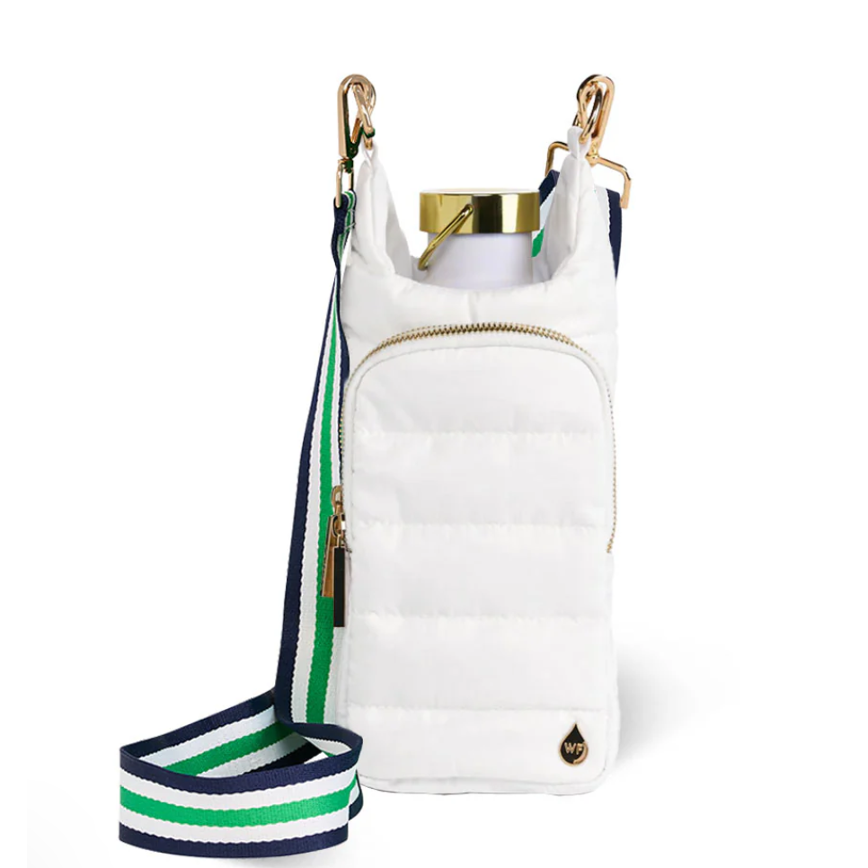 White crossbody bag with a striped strap on a white background