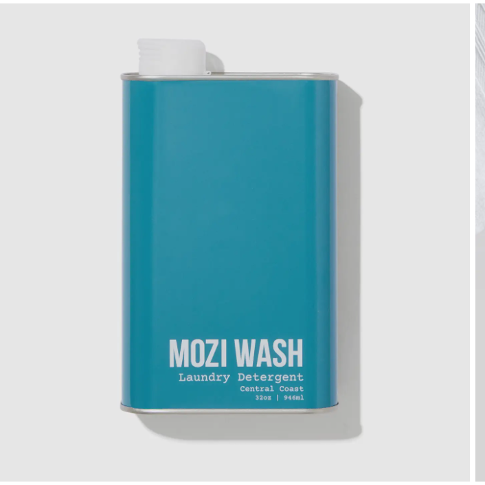Blue container of Mozi Wash laundry detergent on a light gray background