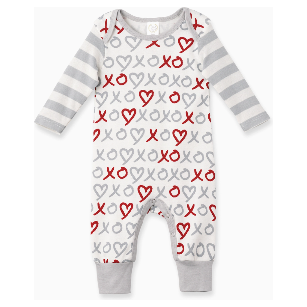 Baby onesie with heart and 'XO' pattern on a white background