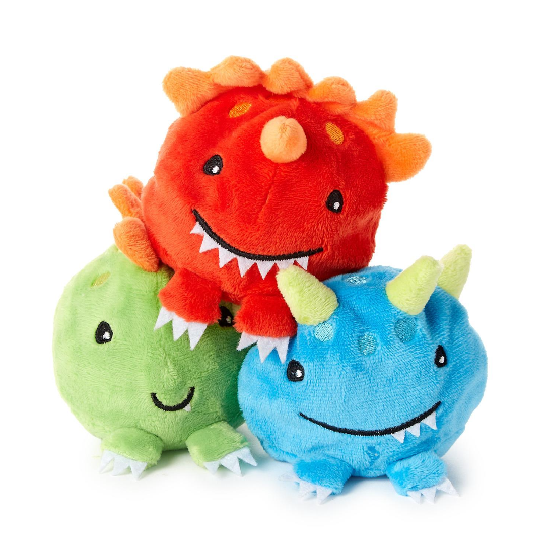 Three colorful plush toys shaped like dinosaurs on a white background