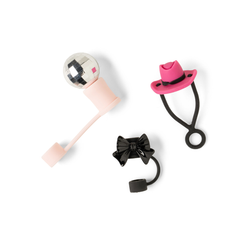 Three decorative items on a white background: a pink and black bow, a pink hat, and a pink and silver ball.