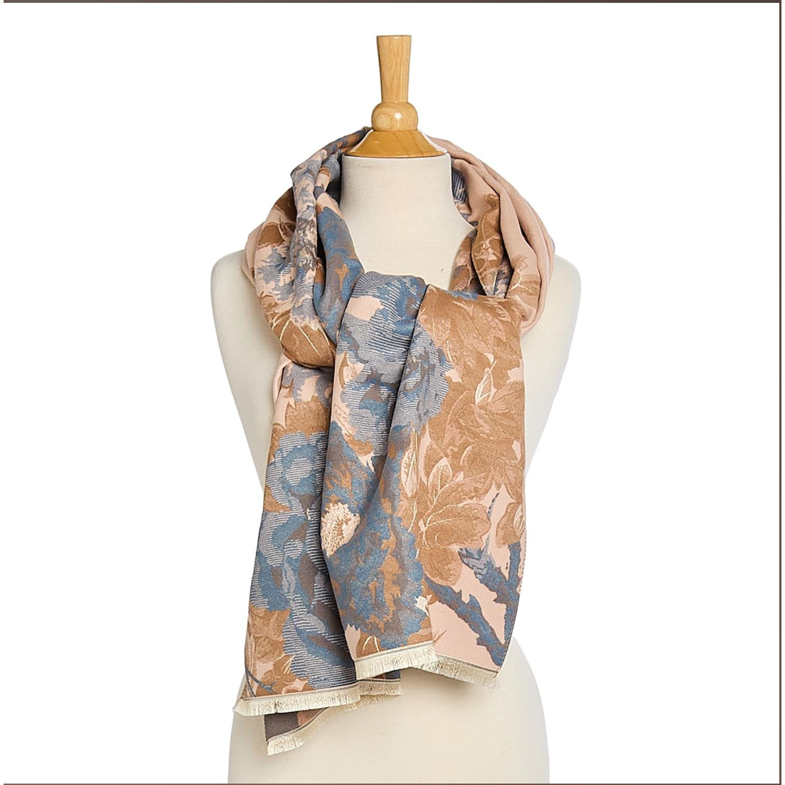 Floral patterned scarf on a mannequin against a white background