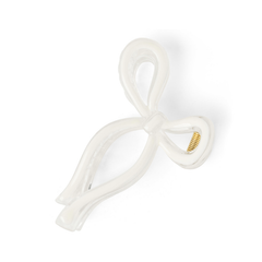 White plastic component with gold screw on a white background