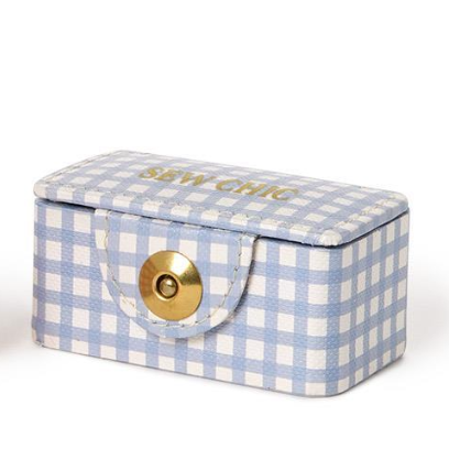Blue and white checkered sewing box with a gold handle on a white background
