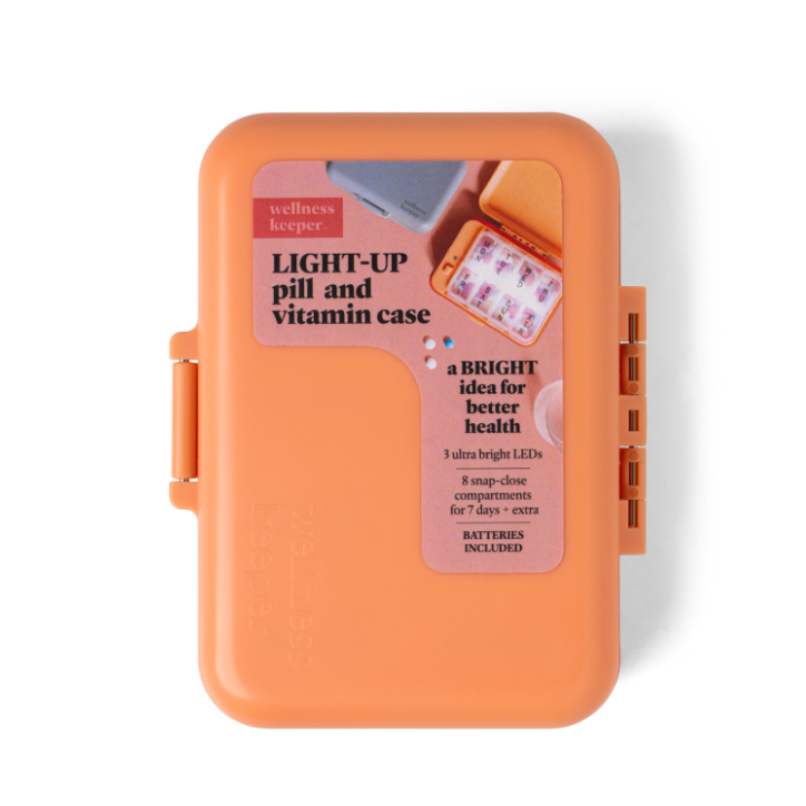 Orange pill case with LED light feature on a white background