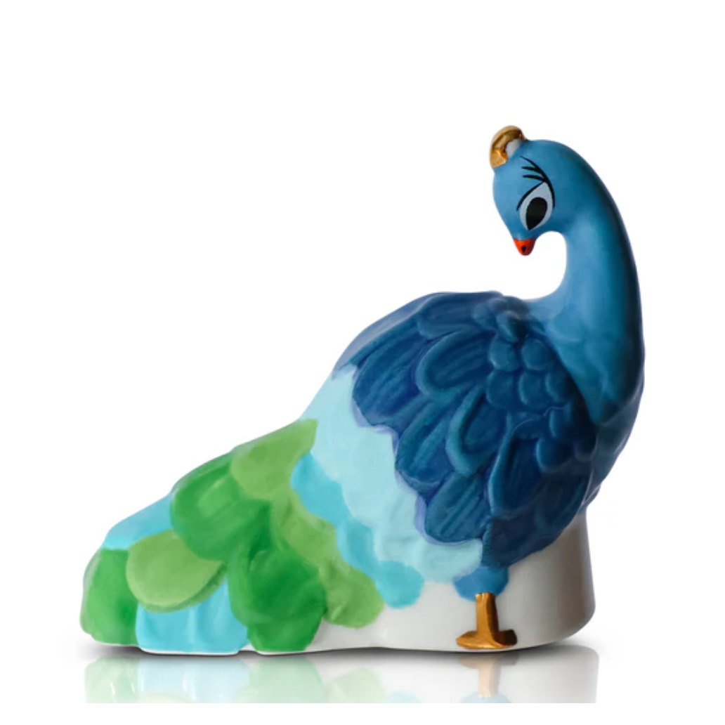 Colorful ceramic peacock figurine on a white background