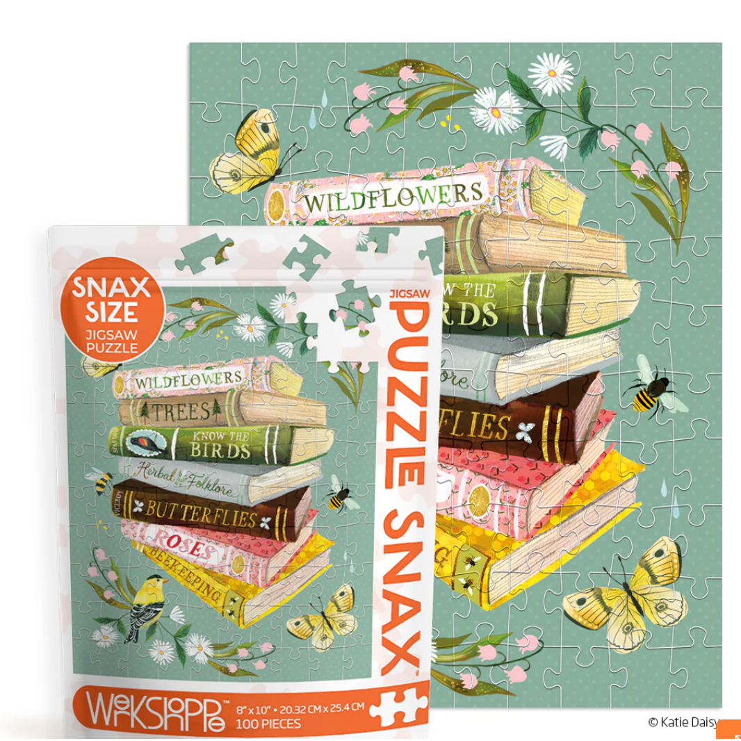 Jigsaw puzzle with books and nature-themed design, featuring 'Snax Size' label.