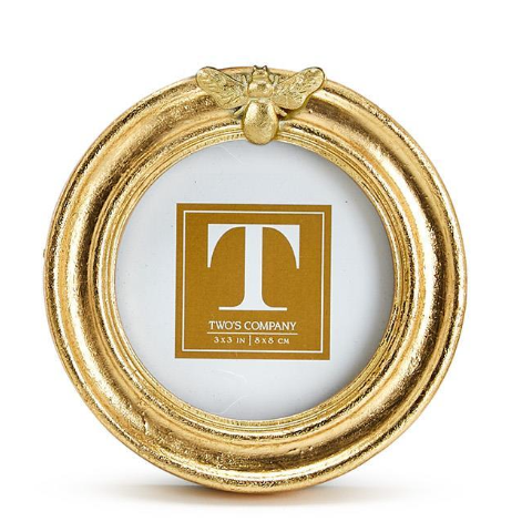 Gold circular frame with a decorative 'T' logo on a white background