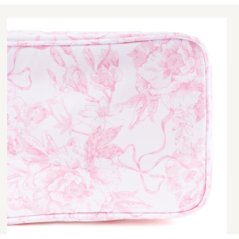 Pink and white floral patterned blanket on a white background