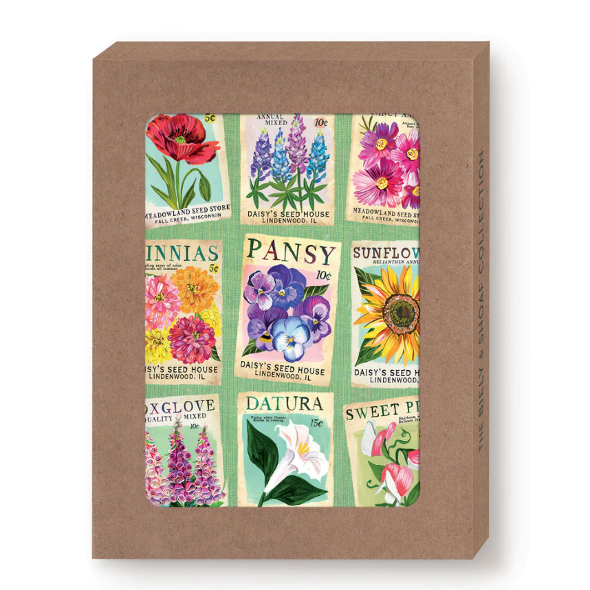 Box of seed packets with colorful floral designs on a brown background