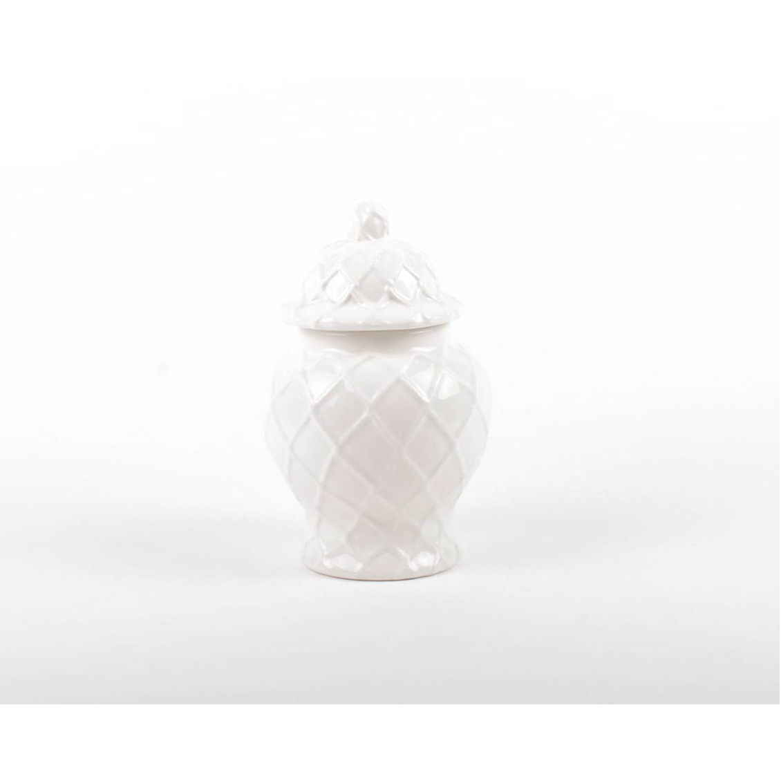White ceramic jar with a textured design on a white background