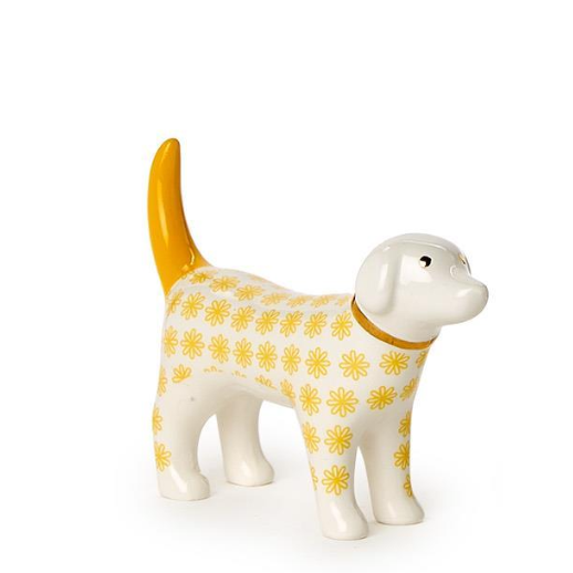 White dog figurine with yellow floral pattern and tail on a white background