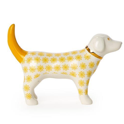 Dog figurine with yellow floral pattern on a white background