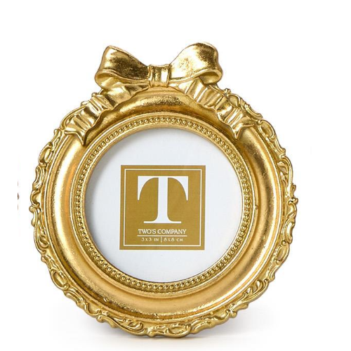 Gold decorative frame with a bow on a white background