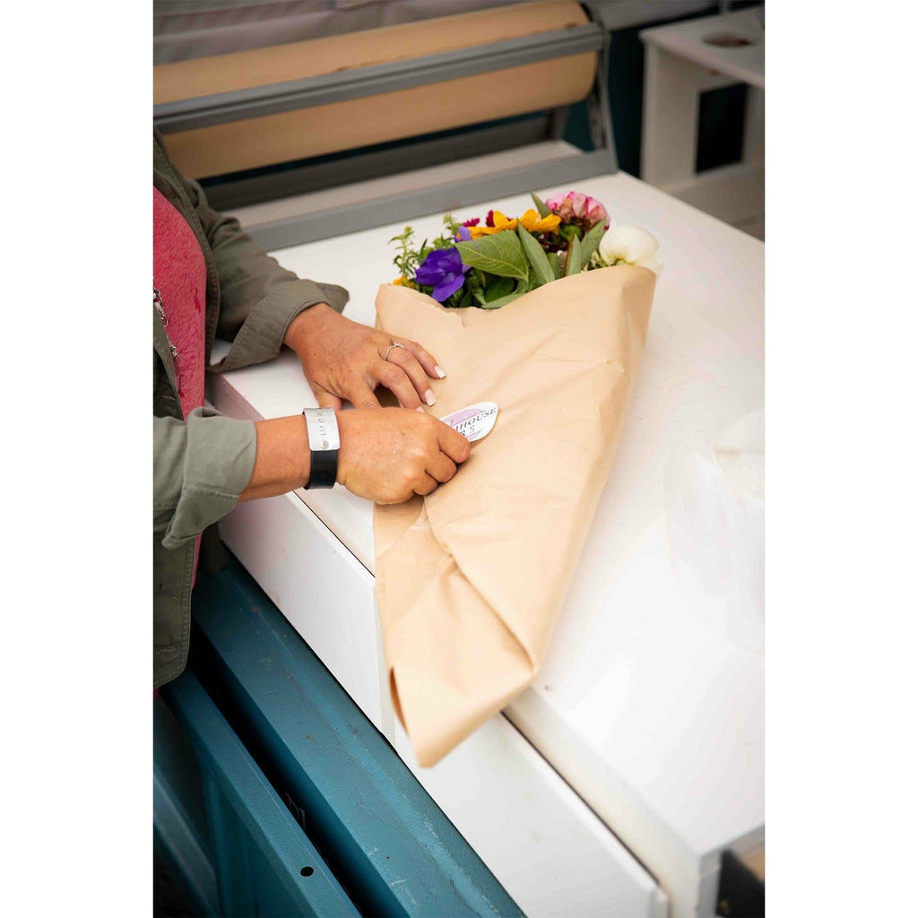 Wrapping flowers on the flower truck