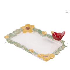 Decorative ceramic tray with floral design and bird figurine on a white background