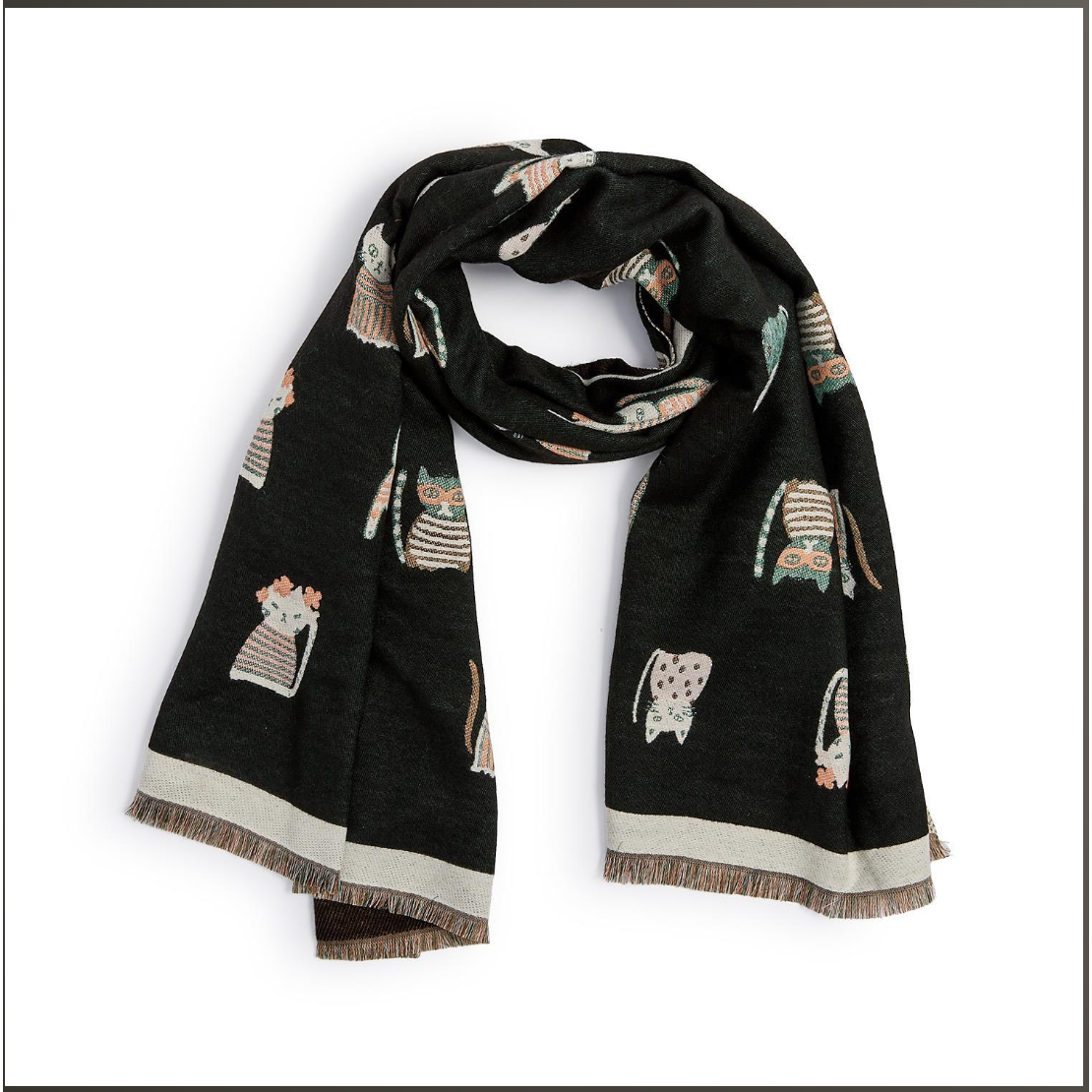 A black scarf featuring a whimsical pattern of small cats in striped and spotted outfits, finished with a cream border and fringed ends, displayed on a white background.