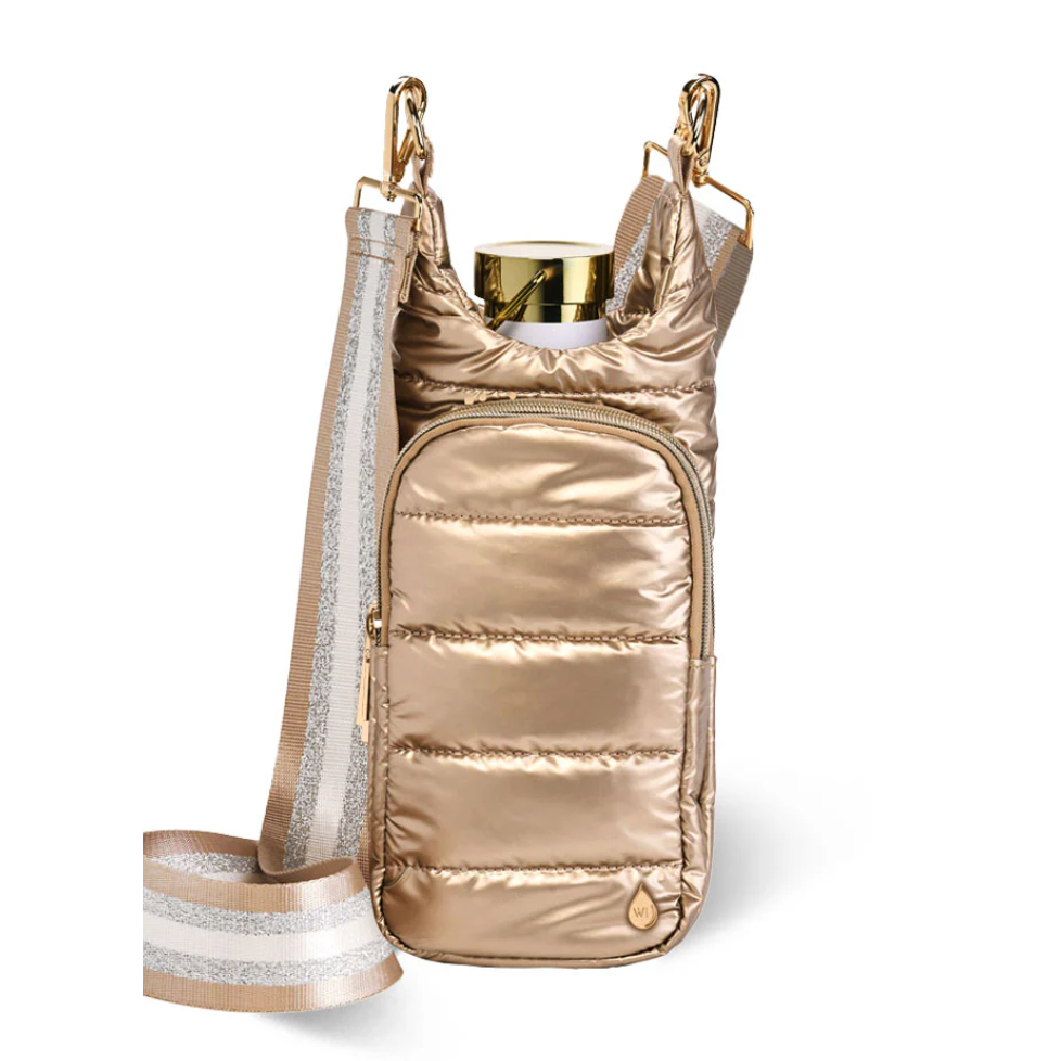 Gold metallic handbag with a strap on a white background