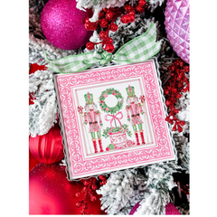 Decorative card with Nutcracker design on a Christmas tree with ornaments.