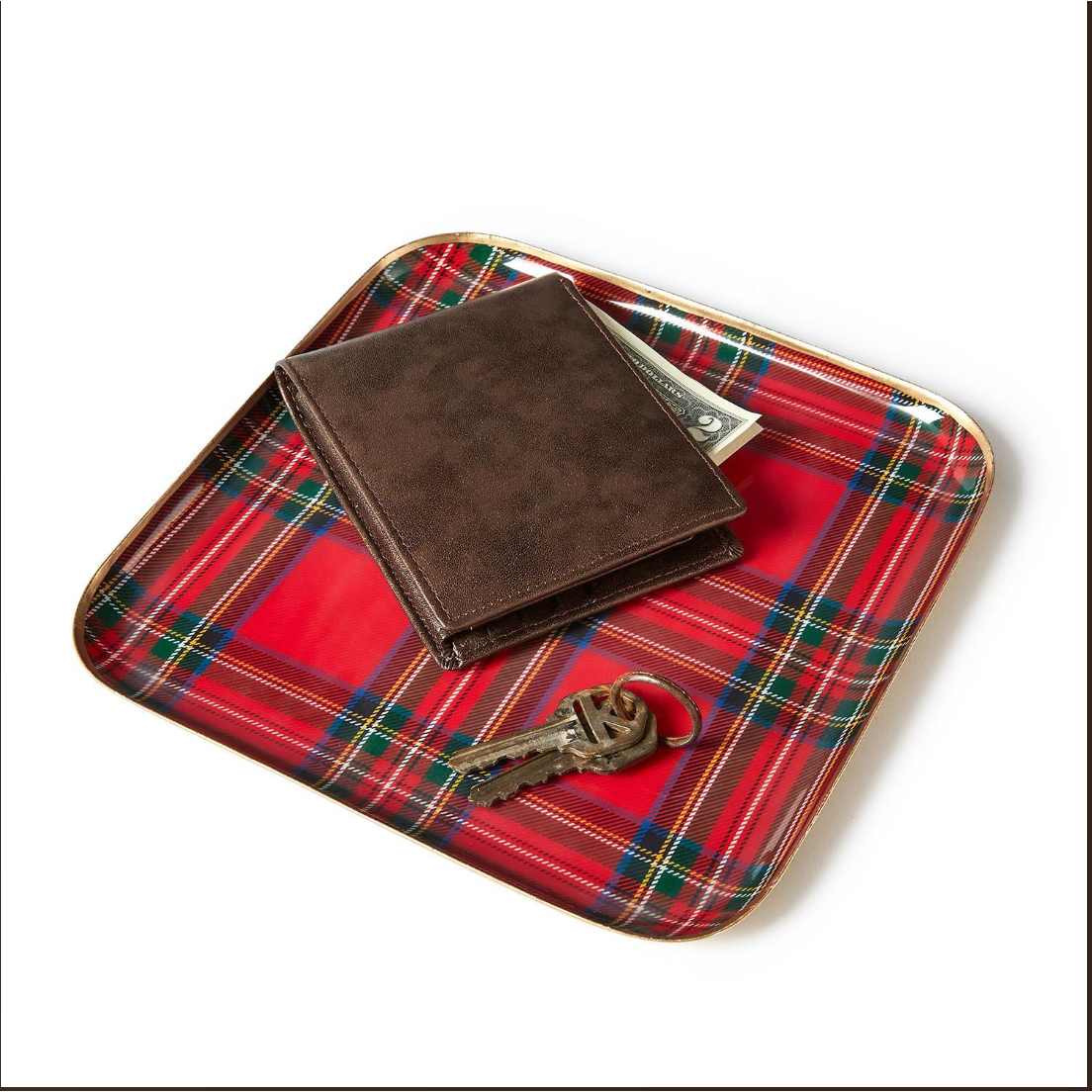 Brown leather wallet and keys on a red plaid tray