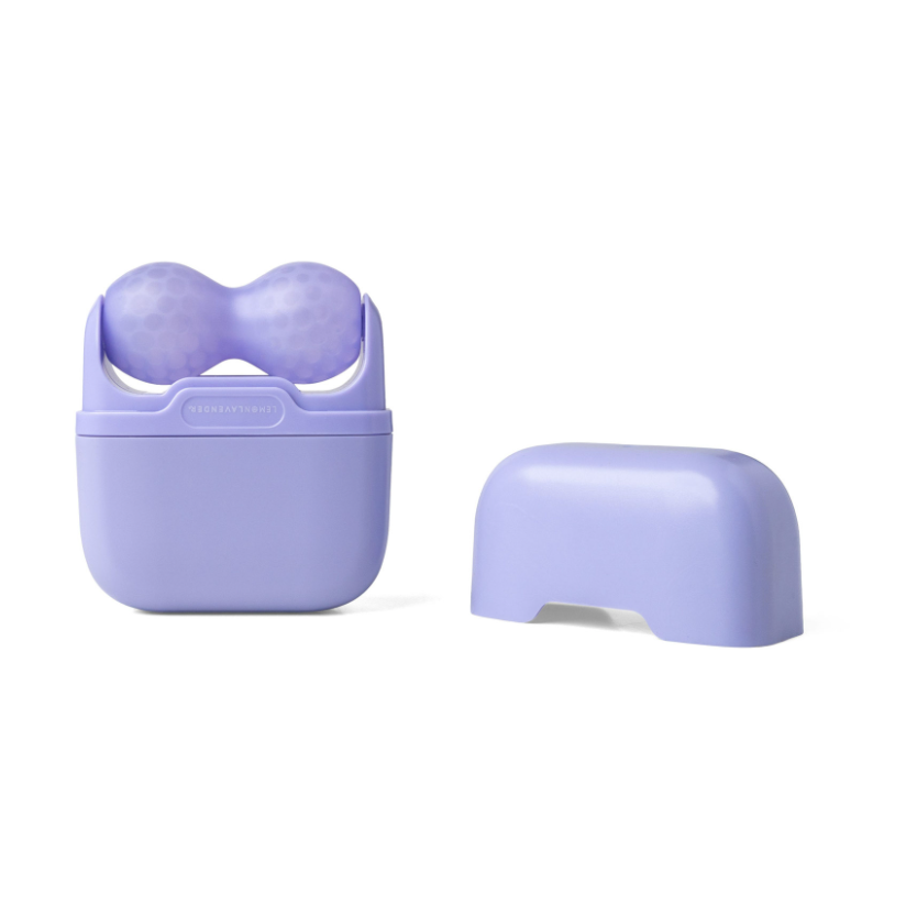 A lavender silicone breast massage device shown next to its matching charging case lid on a clean white background. The brand name 'BREASTMAMMAL' is embossed on the front of the case.