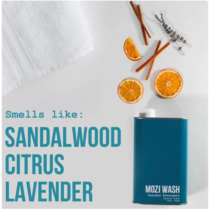 Blue MOZI WASH laundry detergent bottle with sandalwood, citrus, and lavender text on a white background.
