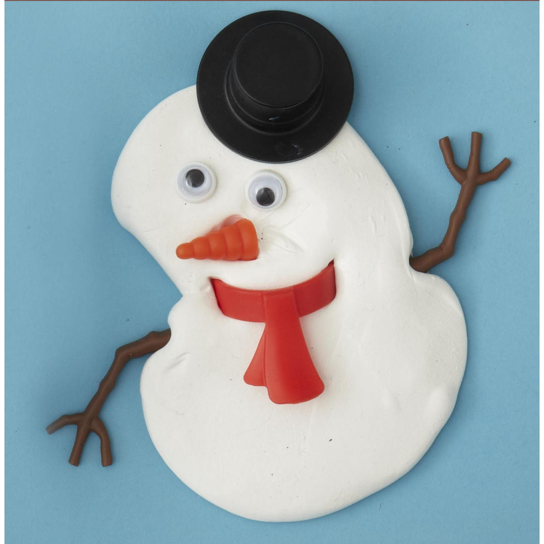 Simple snowman decoration with a black top hat, red scarf, and carrot nose on a blue background