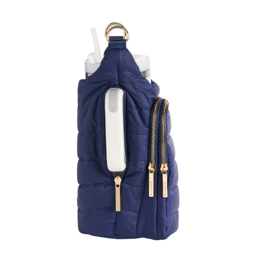 Navy blue puffer vest with gold zippers and accents on a white background