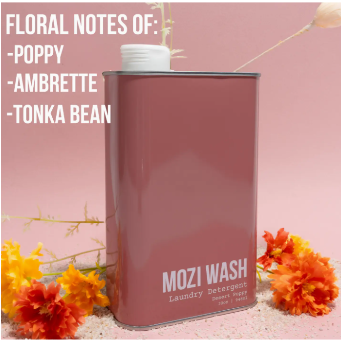 Mozi Wash laundry detergent can with floral elements on a pink background