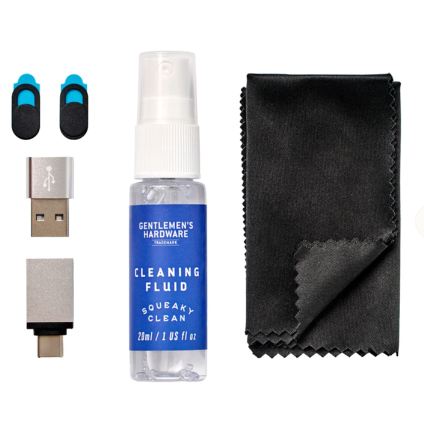 Gentlemen's Hardware Squeak Clean cleaning fluid kit with a 20ml spray bottle, two black and blue rubber grommets, a USB-A to USB-C adapter, and a black microfiber cloth on a white background.