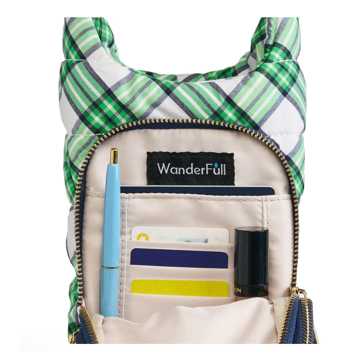 Green plaid backpack with open front pocket showing organizer compartments and WanderFull logo.