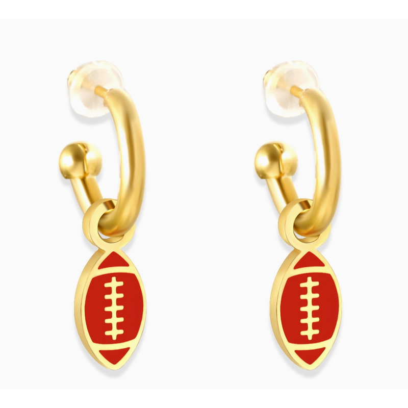 Gold hoop earrings with red football charms on a white background