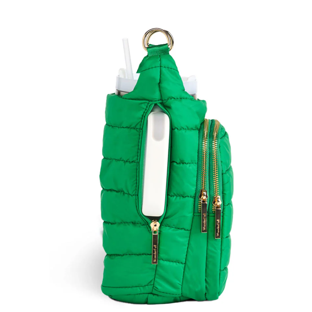 Green puffer bag with gold zippers and handles on a white background