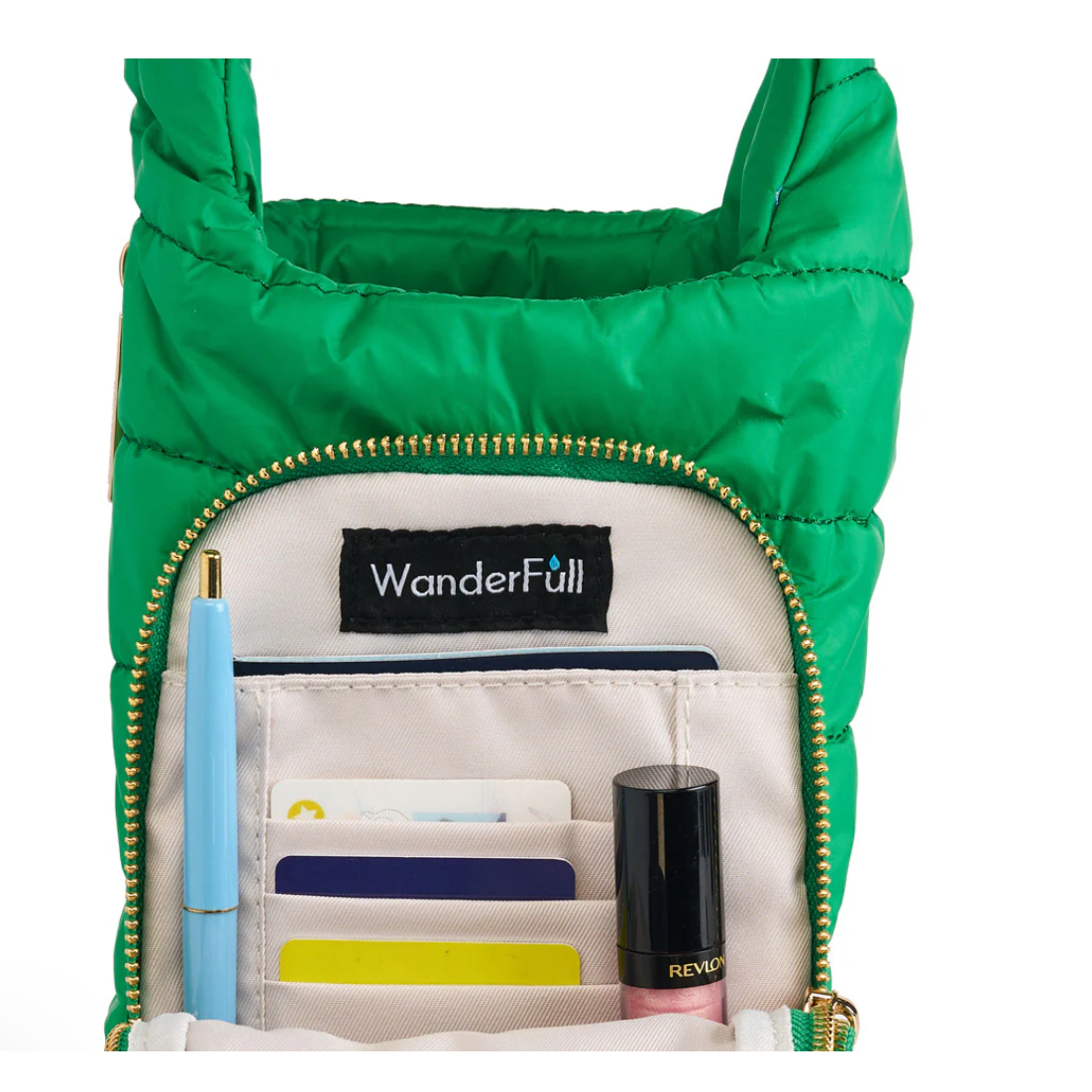 Green crossbody bag with 'WanderFull' branding, open to show compartments and items.