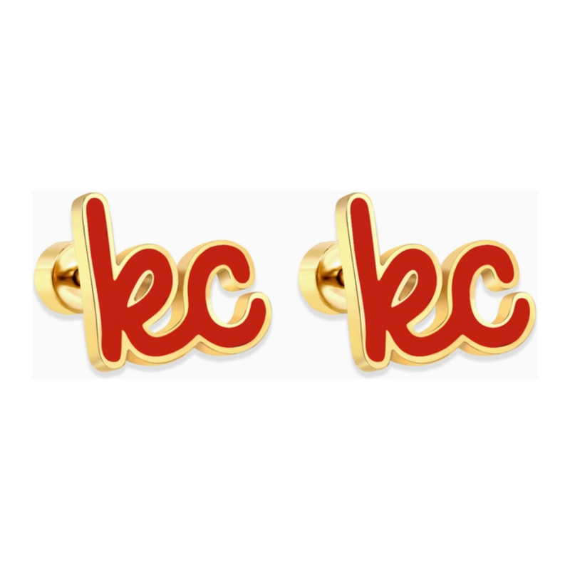 Gold earrings with red 'kc' letters on a white background