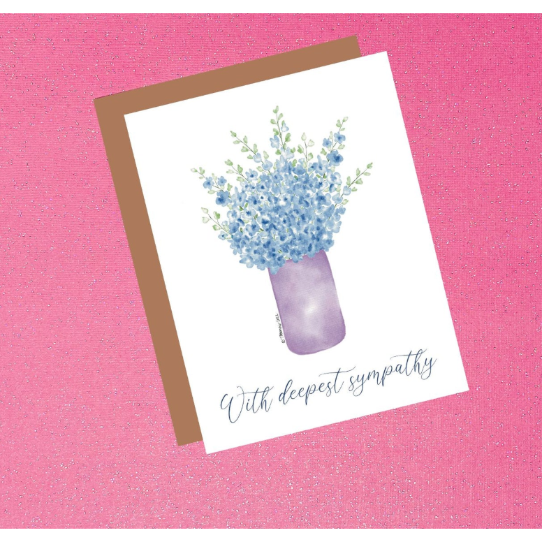 Greeting card with floral design and 'With deepest sympathy' text on a pink background