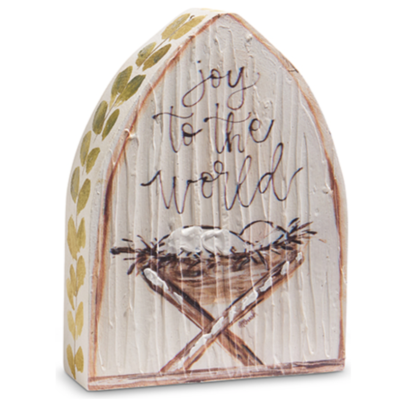 Decorative wooden sign with 'joy to the world' text and a manger scene.