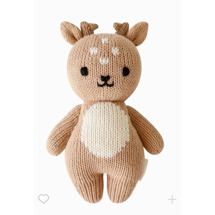 Knitted deer toy on a white background