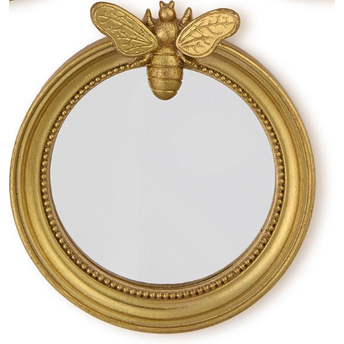 Gold bee-shaped mirror on a white background
