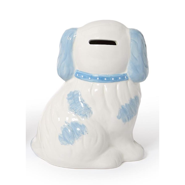 A ceramic dog-shaped money box with a glossy white body, light blue floppy ears, and light blue patches, featuring a slot on its head and a blue collar with white dots.