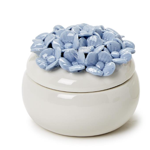 White ceramic pot with blue floral top on a white background