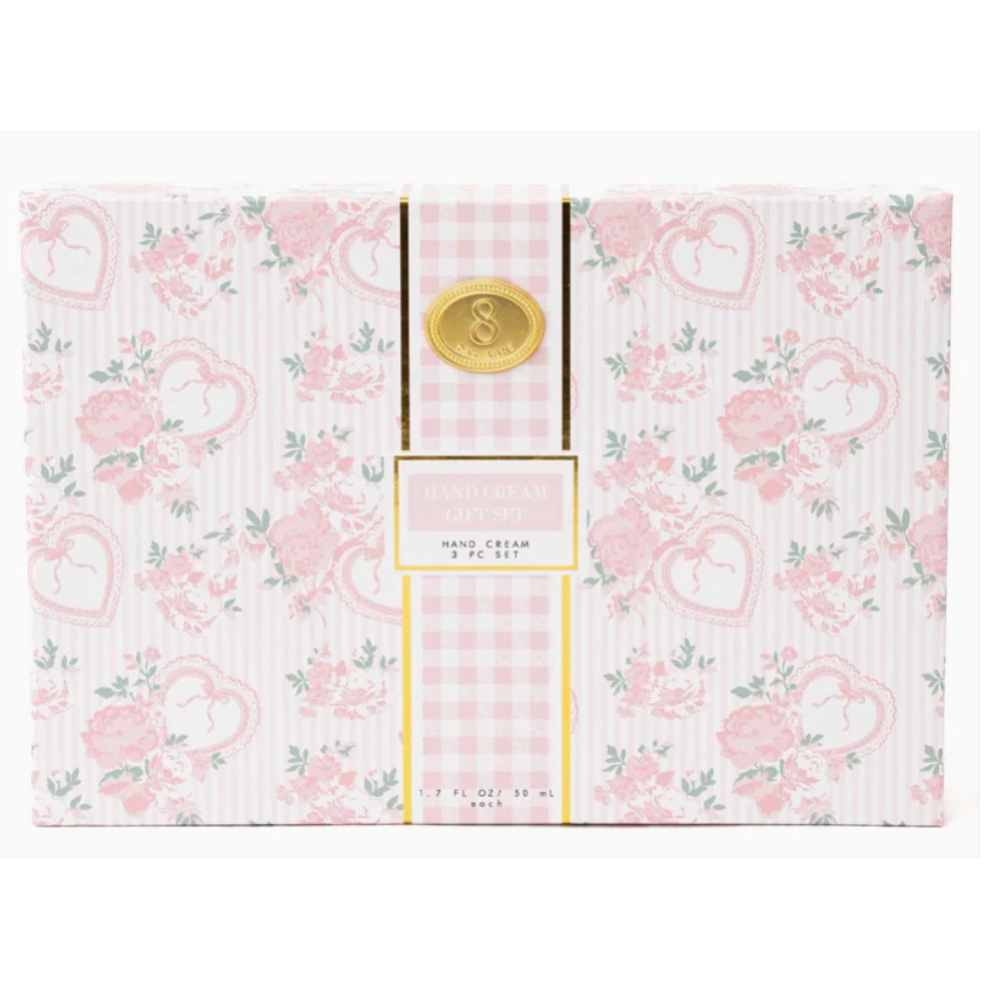Hand cream set with floral and checkered design on a white background