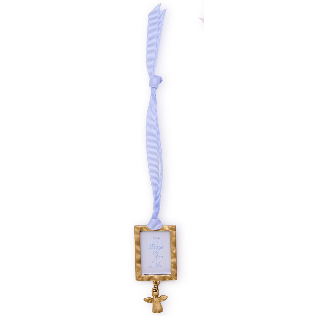Decorative ribbon with a gold frame and angel charm on a white background