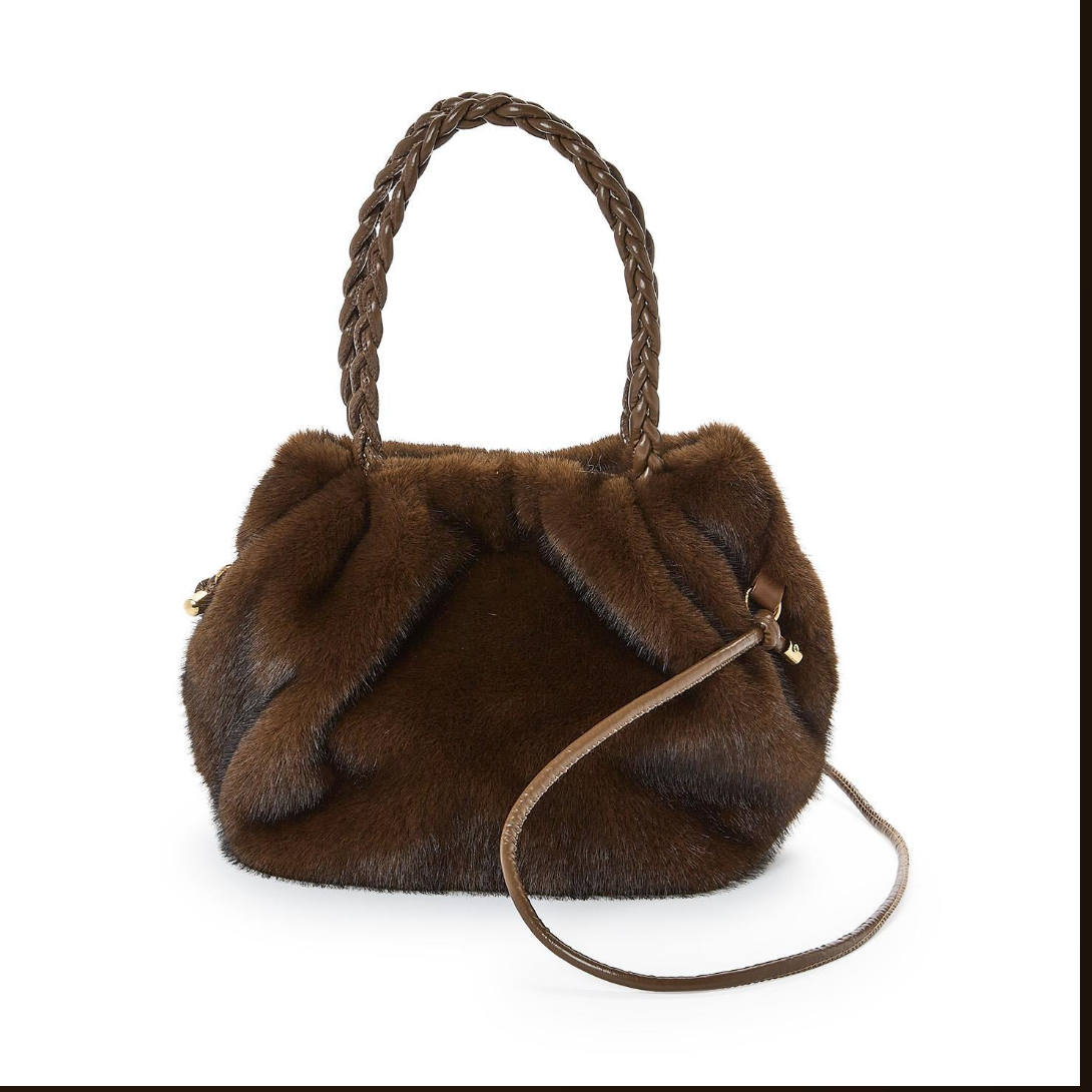 Brown fur handbag with braided handle on a white background