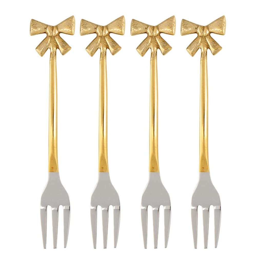 Four gold-handled silver forks with bow designs on a white background