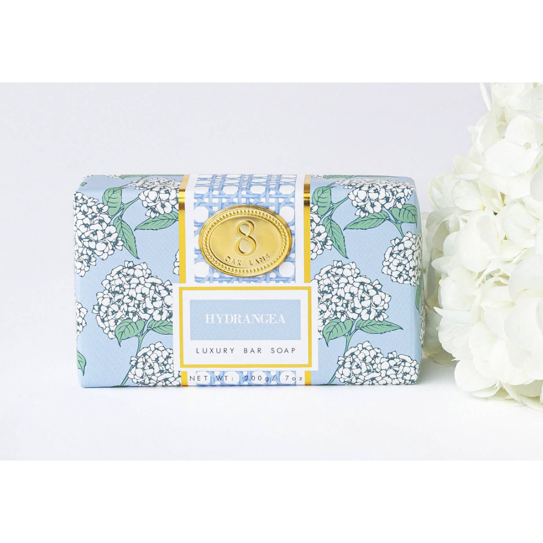 Luxury bar soap with floral packaging on a white background