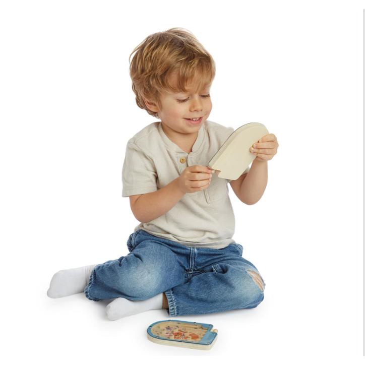 Child playing with a wooden toy on a white background