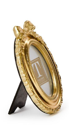 Decorative gold picture frame with a stand on a white background