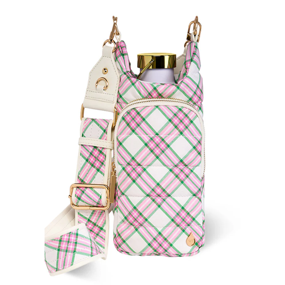 Pink and green plaid bag with gold accents on a white background