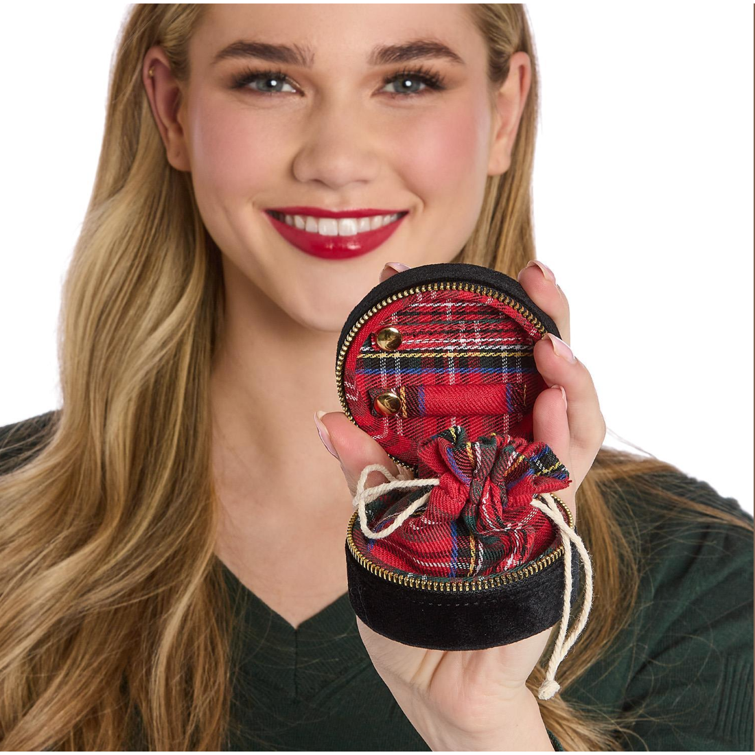Woman holding a red plaid coin purse with a white background